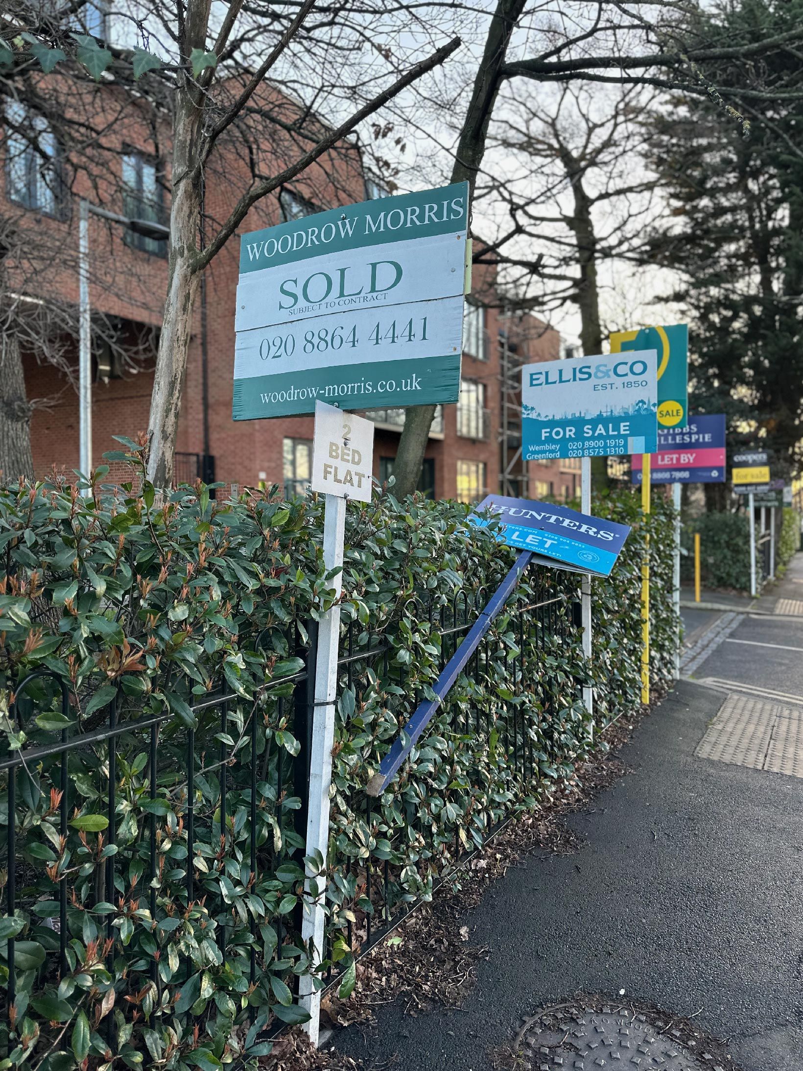 estate agent signs outside a building