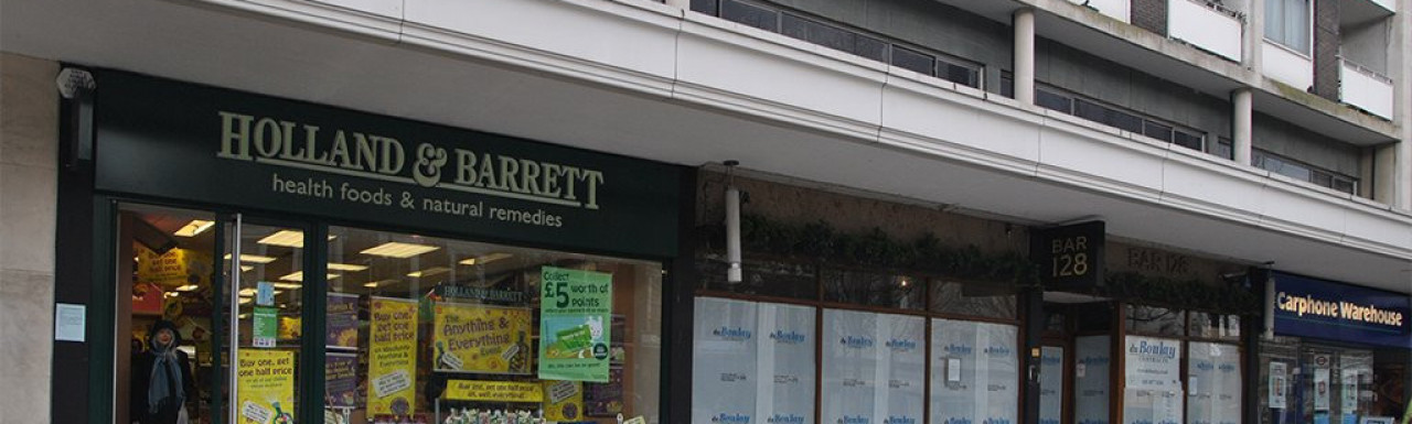 Holland & Barrett store at Ivy Lodge building on Notting Hill Gate in London W11.