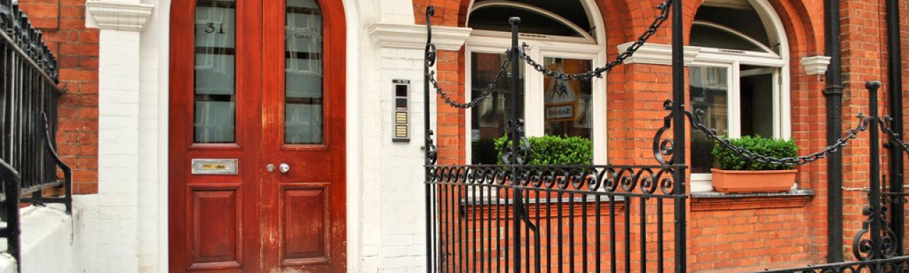 Red brick entrance to 31 Palace Court in Bayswater, London W2.