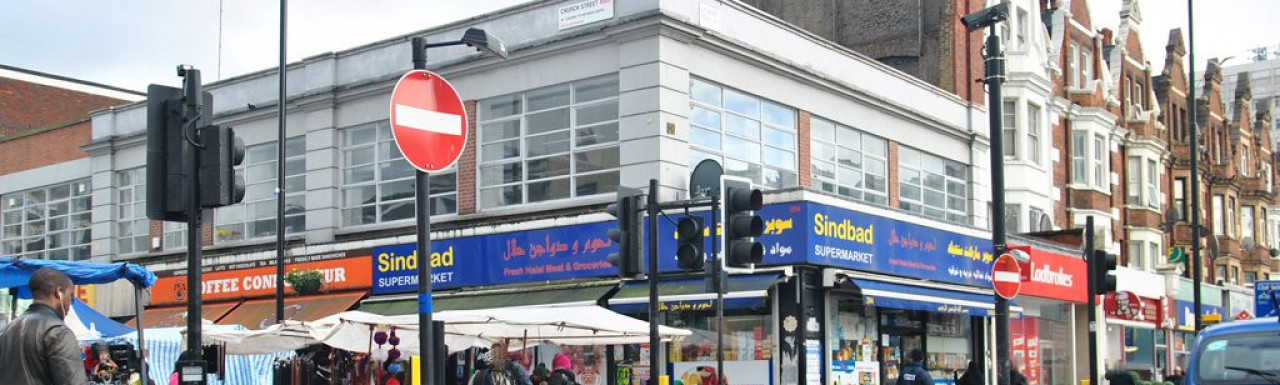 Ladbrokes, Sindbad Superstore and Coffee Connoisseur at 382-386 Edgware Road in 2013.
