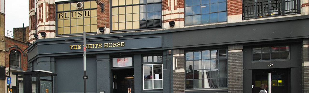 The White Horse pub signs on The Tea Building in 2013.