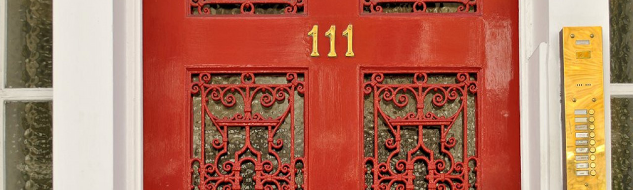 Close-up of the red door at 111 Harley Street.