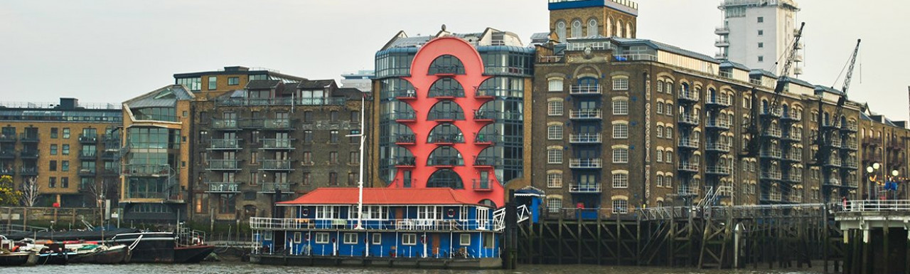 The red China Wharf building on the banks of the River Thames.