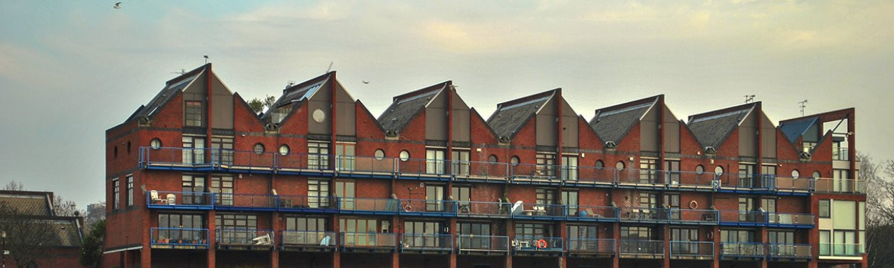Row of terraced houses at King Stairs Close; view from the River Thames.