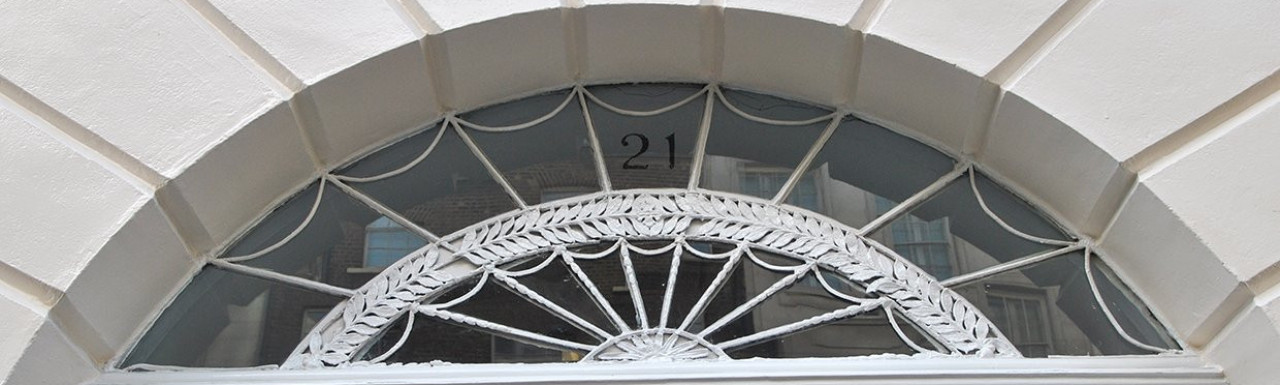 Fanlight above the front door at 21 Upper Brook Street in Mayfair, London W1.