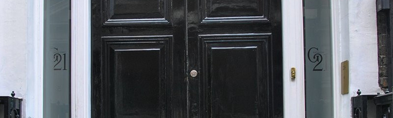 Entrance to 21 Grafton Street building in Mayfair, London W1.
