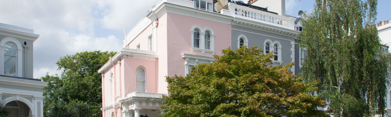 Pink coloured terraced house at 100 Elgin Crescent in Notting Hill, London W11.