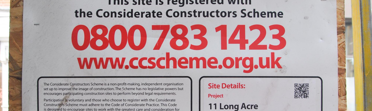 Considerate Constructors scheme poster at 11 Long Acre building in Covent Garden, London WC2.