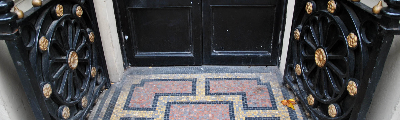 Mosaic tiles at one of the entrances to Royal Institution on Albemarle Street.
