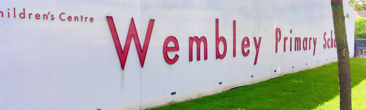 Wembley Primary School building with signage; East Lane elevation.