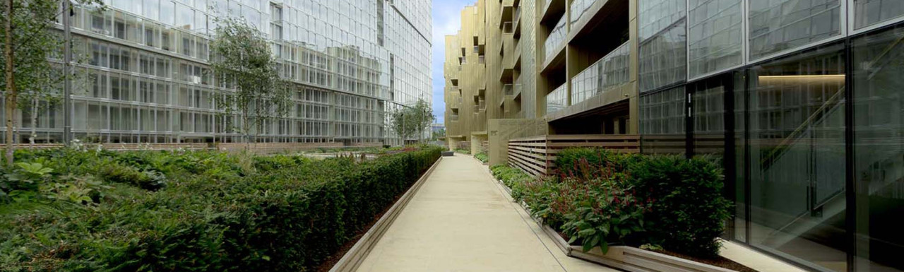Courtyard Gardens next to Faraday House at Circus West within the Battersea Power Station development. Adjustable pedestals by Buzon.