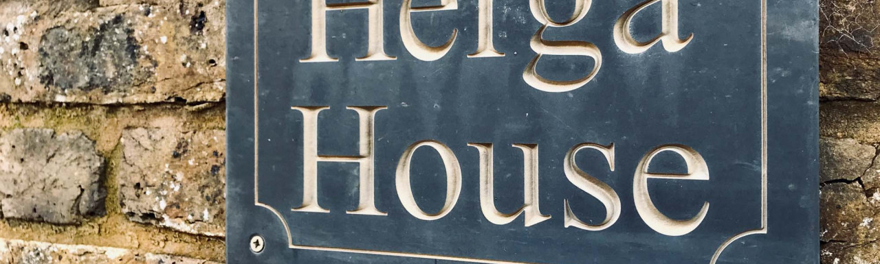 Herga House sign on the brick fence on London Road, Harrow on the Hill HA1.
