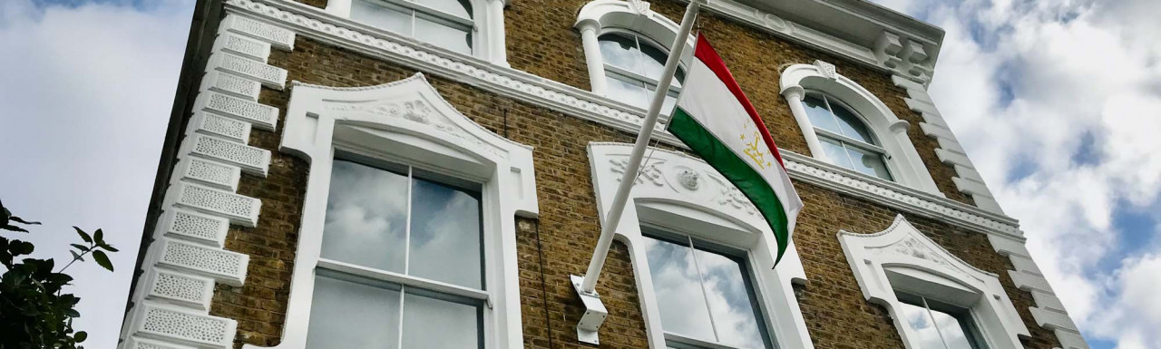 Looking up at Embassy of Tajikistan building on Clarendon Road in Notting Hill, London W11.