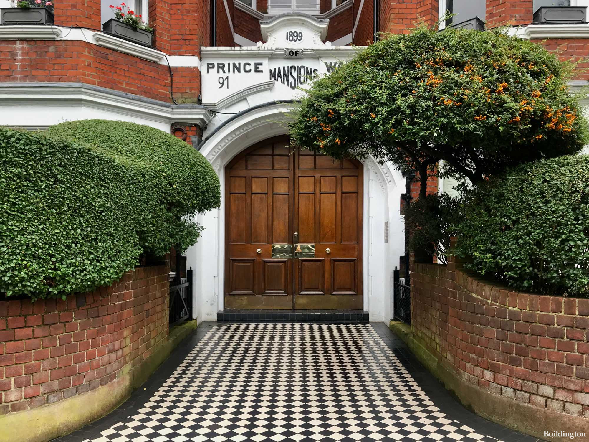 Prince of Wales Mansions entrance to flats No. 91-... on Prince of Wales Drive opposite Battersea Park in London SW11.
