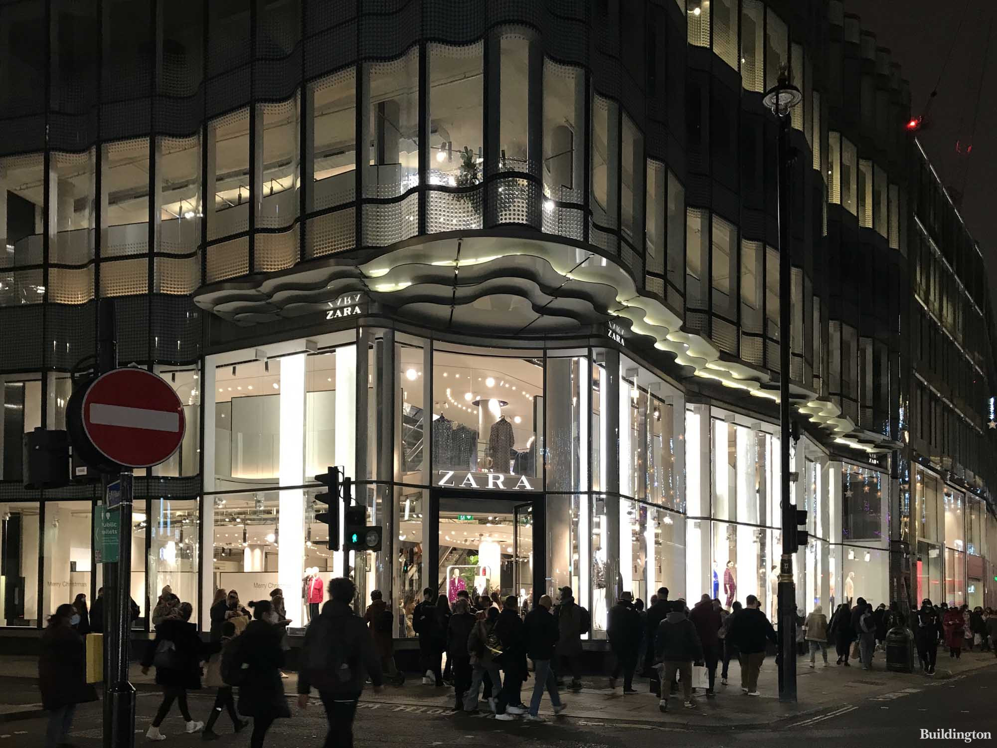 61 Oxford Street/11 Soho Street building at night. Entrance to Zara store on the corner of Soho Street and Oxford Street.
