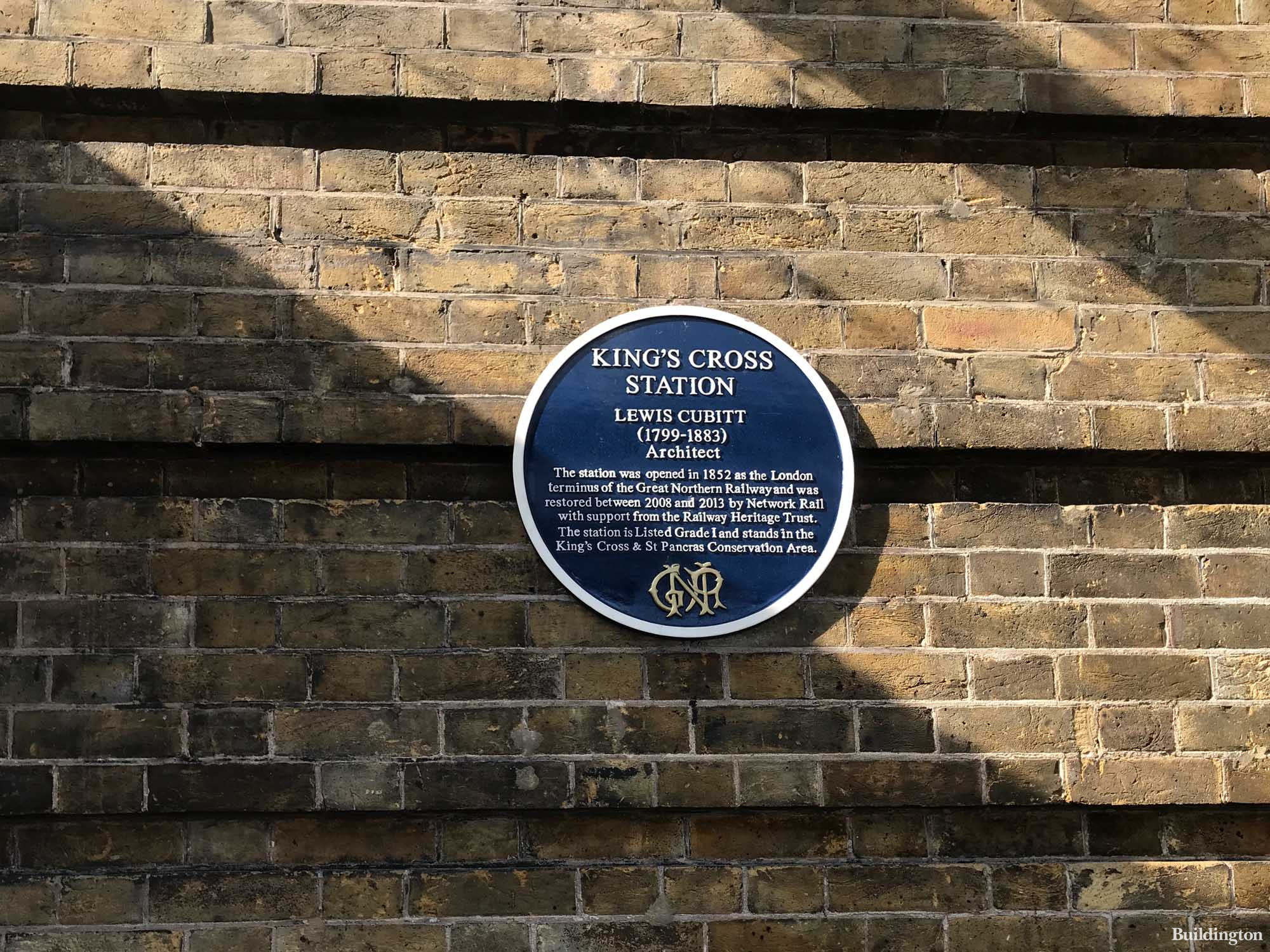 Blue plaque at King's Cross Station for architect Lewis Cubitt.