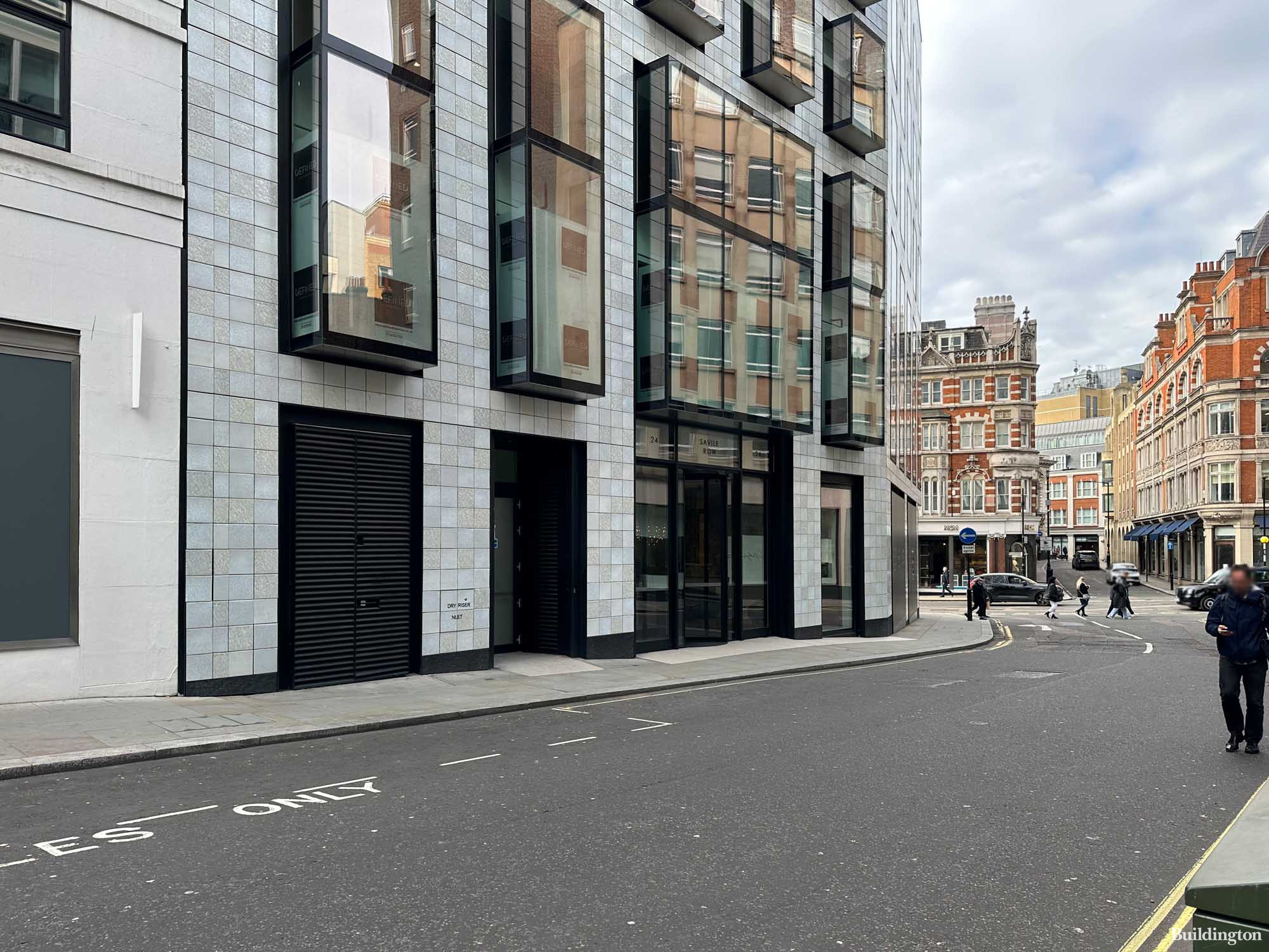 View from Savile Row to Conduit Street next to 49-51 Conduit Street/24 Savile Row building in Mayfair, London W1.