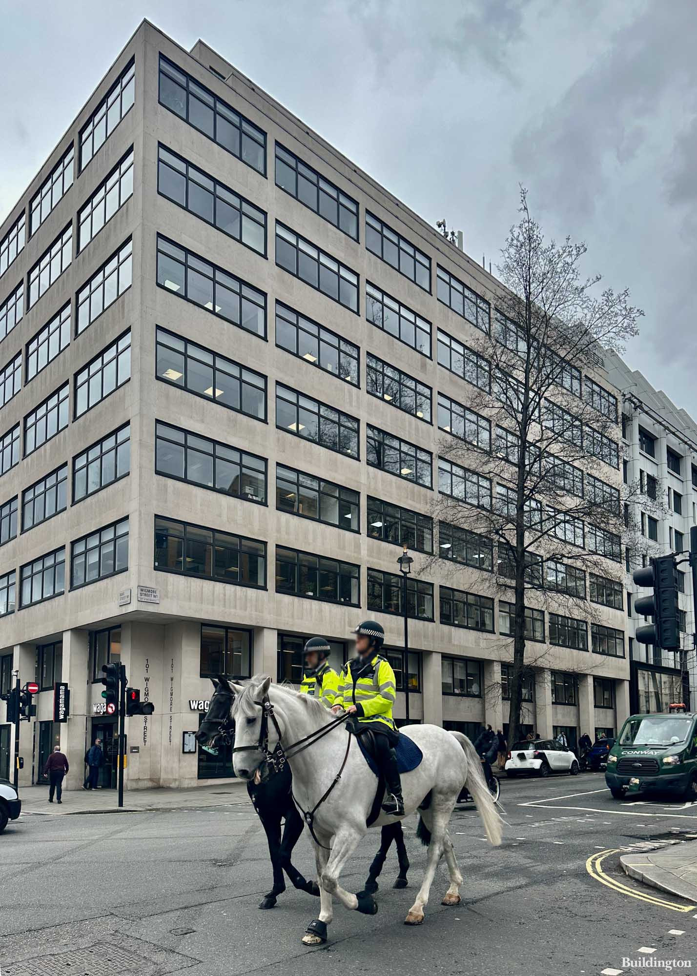 Metropolitan Police on horses in front of 101 Wigmore Street building in Marylebone, London W1.