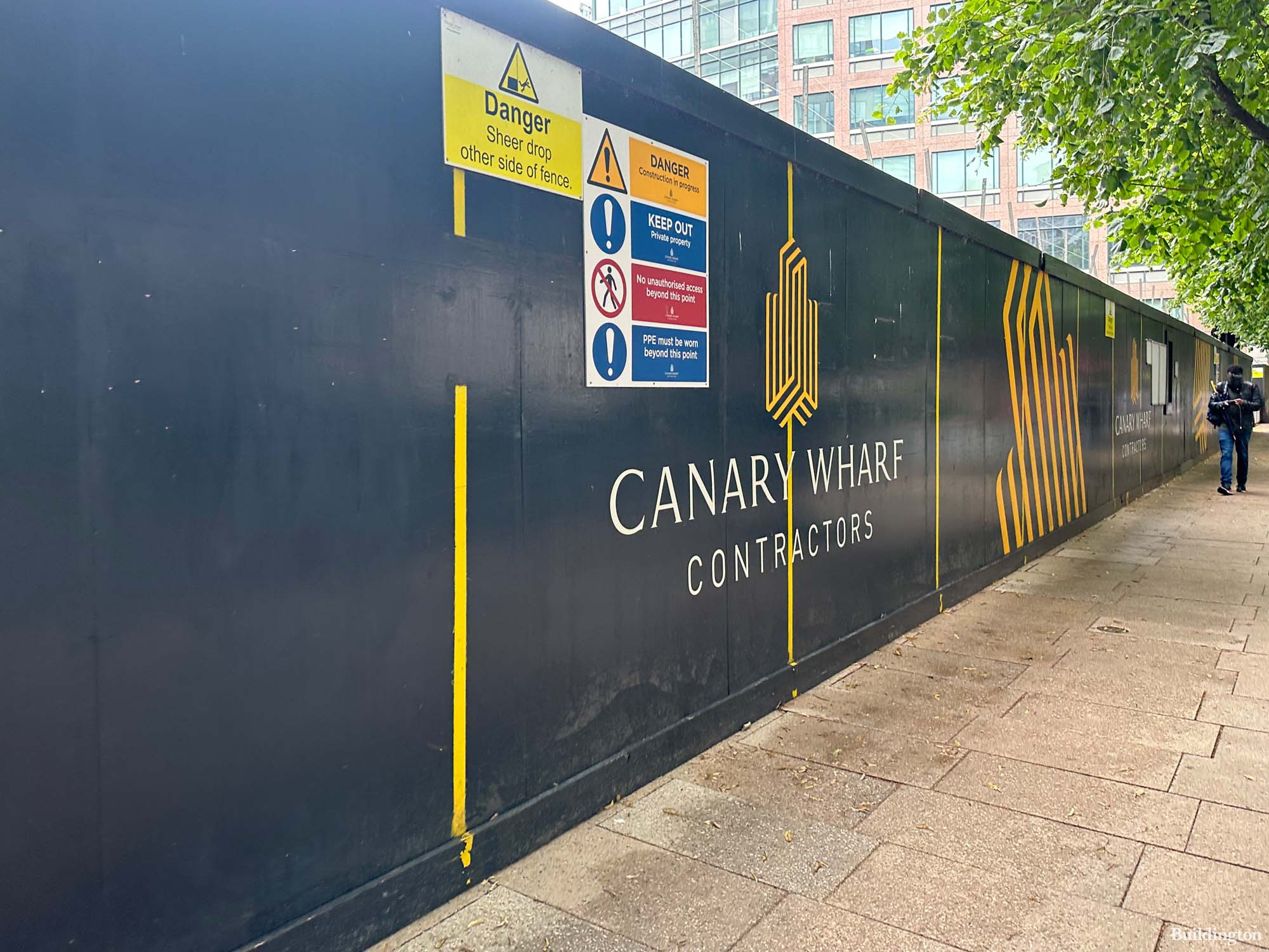 Park Place development hoarding by Canary Wharf Contractors on West India Avenue in Canary Wharf in Summer 2023.