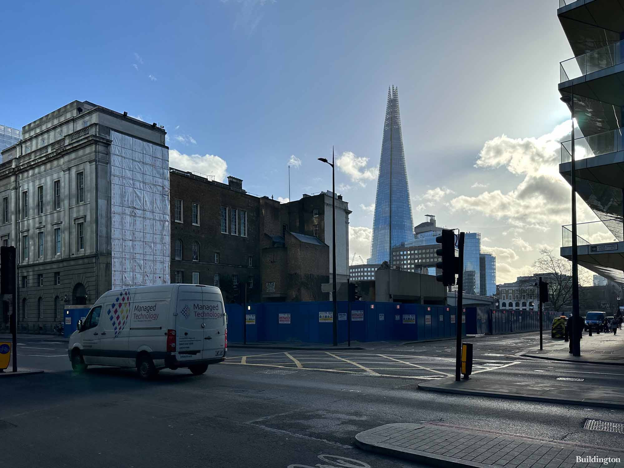 Seal House development site from Upper Thames Street in the City of London EC4. Fishmongers' Hall to the left and The Shard in the background.