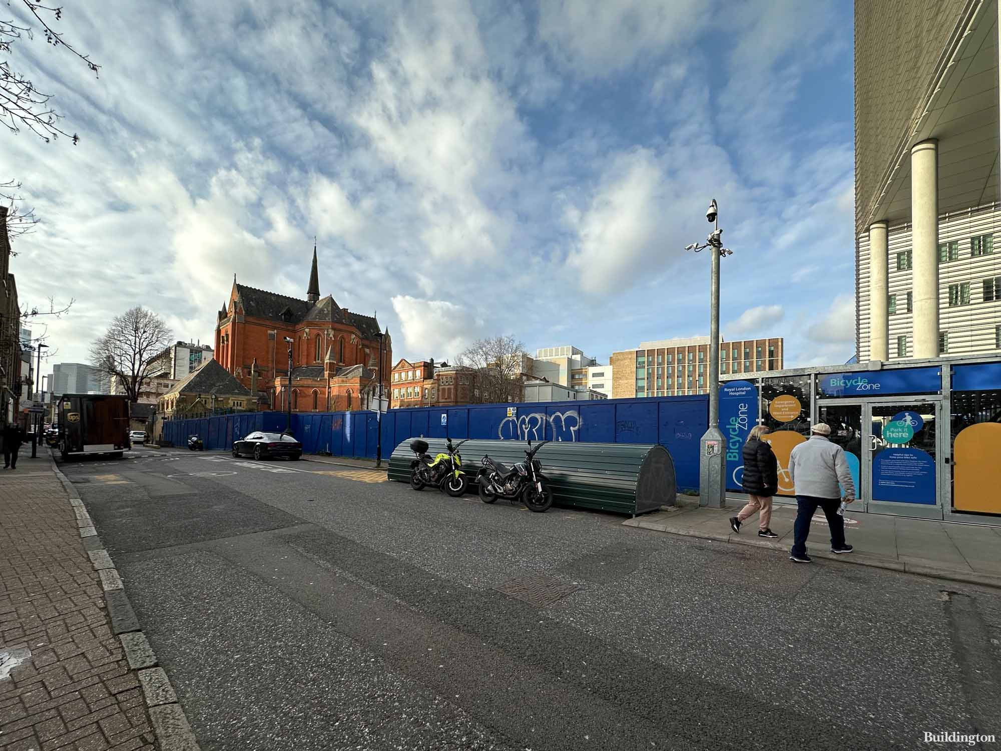 Whitechapel Road Development site on Newark Street in Whitechapel, London E1. The Royal London Hospital to the right and Church of St Augustine with St Philip in the background.