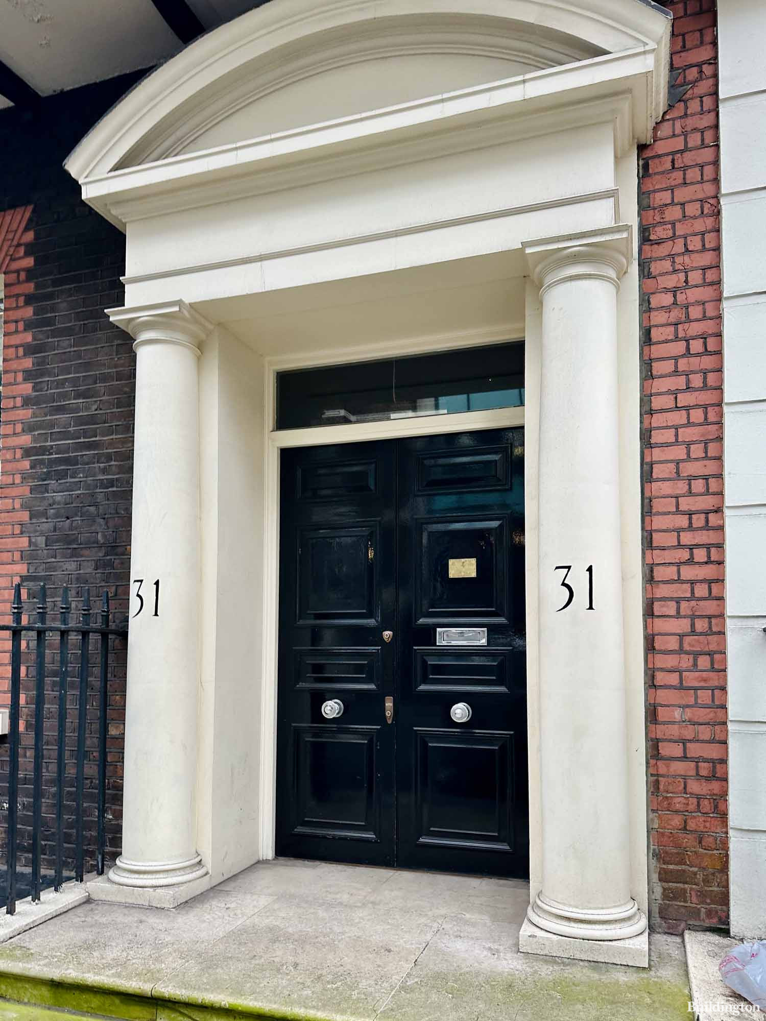 Entrance to 31 Curzon Street building in Mayfair, London W1.