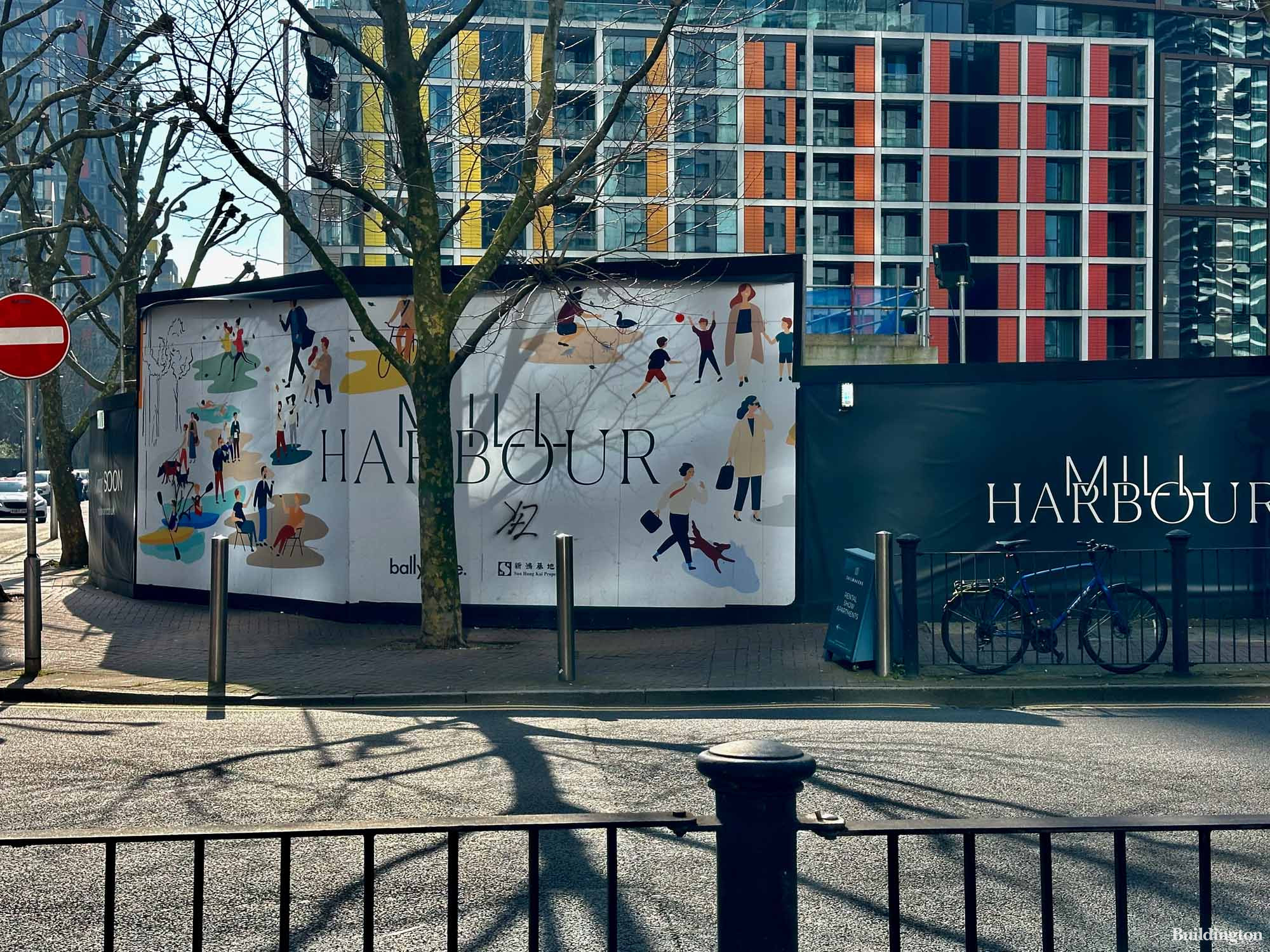 Mill Harbour hoarding on the corner of Millharbour and Marsh Wall on the Isle of Dogs in London E14.
