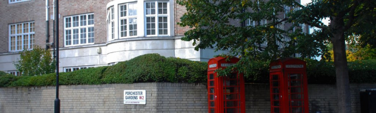 Two red phone booths and 2 Porchester Gardens in 2009.